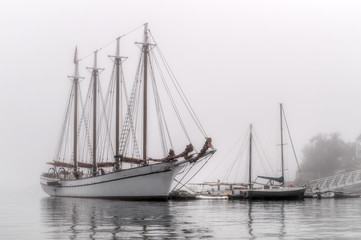 Fototapeta na wymiar Sailboats in the Fog