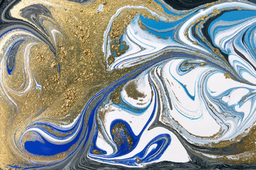 Gold marbling texture design. Blue and golden marble pattern. Fluid art.