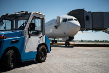 We ready for the flight. Close up of mini work car and passenger airplane. Copy space in right side