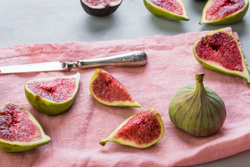 figs on a pink napkin, cut, tropical fruit, concept, copy space