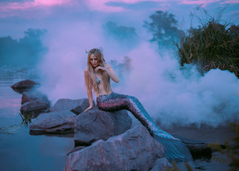 Image of a beautiful mermaid is sitting on the rock in the purple fog printed on Printed Glass Splashbacks