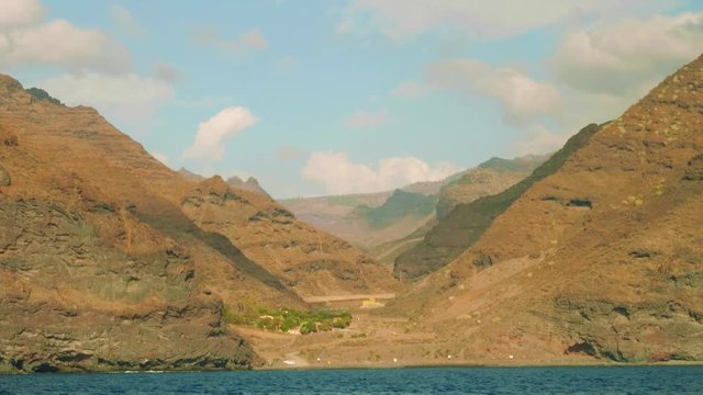 Opening view of ricky clove of Gran Canaria island. View from sailing yacht