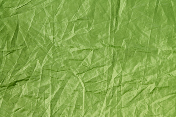 light green crumpled material texture, background