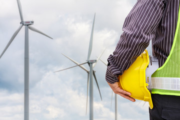 Engineer worker at wind turbine power station construction site