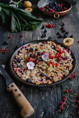 appetizing pie with berries on wooden table