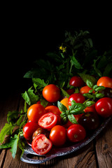 various types of tomatoes served and presented on the silver platter.