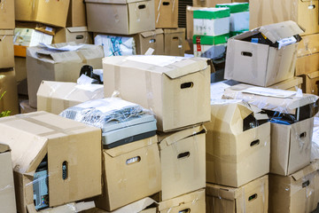 Carton boxes with stuff in room. Office move concept