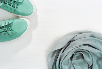 Warm scarf and comfortable shoes bright color on white background. Fashion and design of warm...