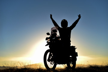 Obraz na płótnie Canvas free motorcyclist, lifestyle and travel