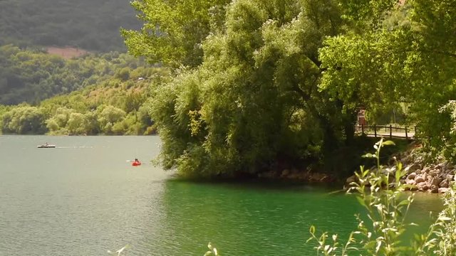 peacefull panorama of a small lake shore in the summer