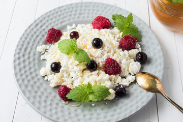 Russian cottage cheese with berries, honey mint, selective focus, healthy Breakfast