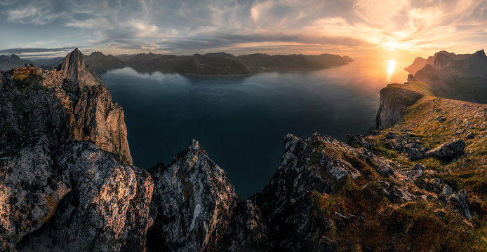 Mountainous panorma landscape view with huge fjords during golden sunset in Senja, Norway