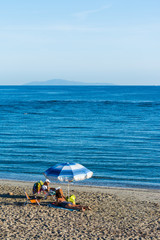 Fototapeta na wymiar beach umbrella on the beach
