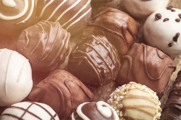 Dark, milk and white chocolate candies