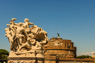 Castel Sant'Angelo and Ponte or bridge Sant'Angelo in Rome, Italy.  View of the bridge ornaments with the Castle Saint Angelo in the background.