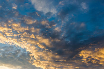 Dramatic sunset cloud with blue and gold color