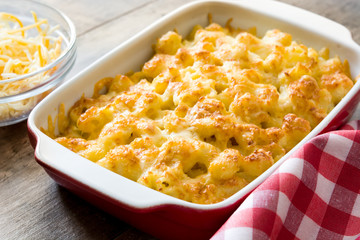 Typical American macaroni and cheese on wooden table