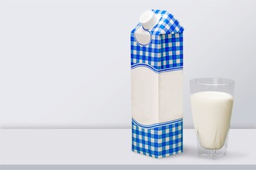Glass of milk and box on  background