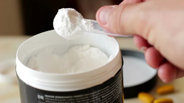 Sport supplement. Сreatine monohydrate , bcaa, amino acid or vitamin scoop with powder
