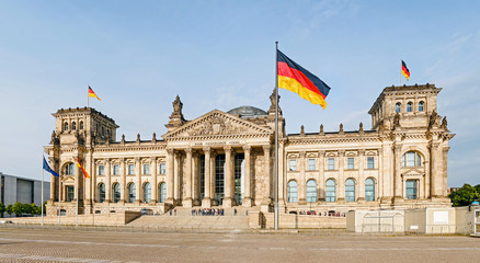 Fototapeta na wymiar view of famous Reichstag or Bundestag building, seat of the German Parliament with no people. Travel and Politics in Berlin concept