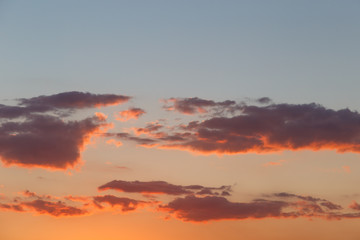 Background of colorful sky concept: Dramatic sunset with twilight color sky and clouds.