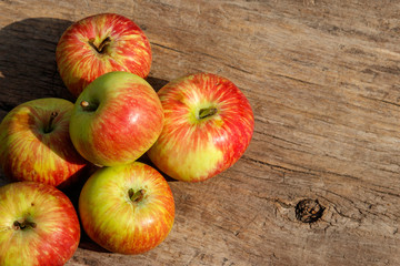 Fresh ripe apples on wooden table. Top view, copy space