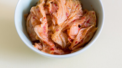 Cabbage kimchi in the bowl, very popular korean traditional fermented food.