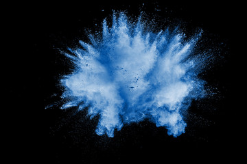 Splash of blue dust on black background.