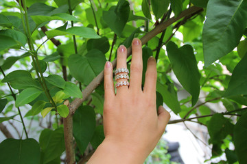 Close up of beautiful woman wearing shiny rings