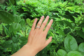 Close up of beautiful woman wearing shiny rings