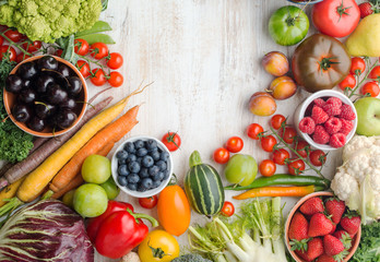 Fresh farm produce, summer fruits vegetables berries, cherries strawberries raspberries broccoli cauliflower squash tomatoes carrots beans, pepper, copy space, top view, selective focus