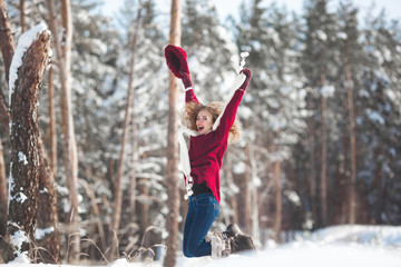 Young beautiful woman having fun in winter time outdoors