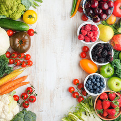 Organic farm produce, assortment of fresh summer fruits vegetables berries, copy space, square, top view, selective focus