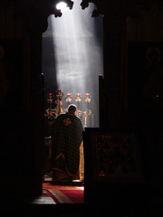 A priest prying in the church