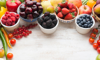 Healthy summer fruits vegetables berries background, cherries strawberries raspberries blueberries blackberries peppers apple red currant, copy space, selective focus