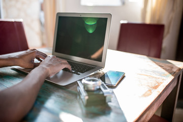 Woman hands working from home on her computer