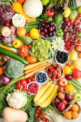 Foto op Canvas Healthy fruits vegetables berries background, cherries peaches strawberries cabbage broccoli cauliflower squash tomatoes carrots bananas beans beetroot, pepper, top view, selective focus © Liliya Trott