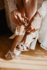 Bride is wearing her wedding shoes
