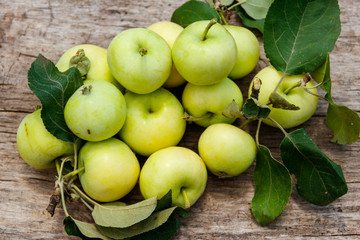 Fresh ripe apples on rustic wooden table