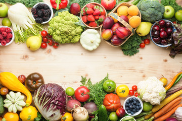 Fresh organic fruits vegetables berries, cherries apricots strawberries cabbage broccoli cauliflower squash tomatoes carrots spring onions beans beetroot, pepper, copy space, top view