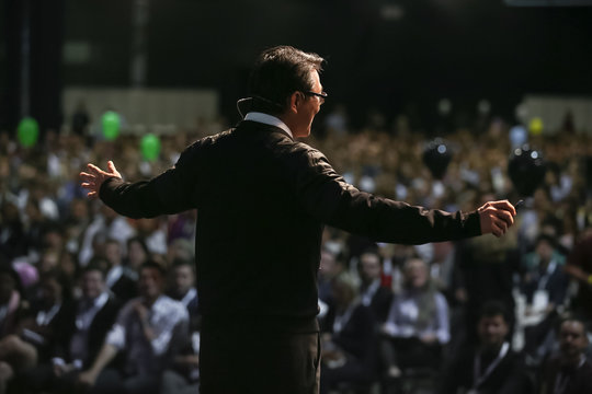 Coach during personal motivational lecture