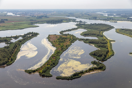 Aerial view estuary Dutch river IJssel with small islands and wetlands in lake Ketelmeer