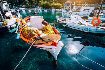 Colorful Greek fishing boats in small port harbor of Kioni on Ithaka island, Greece