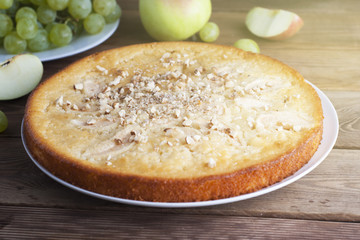 Loaf of Pie or Pound Bread on a Cutting Board. Sweet Dessert Pie, homemade pastry. Wooden table, close up. Breakfast.