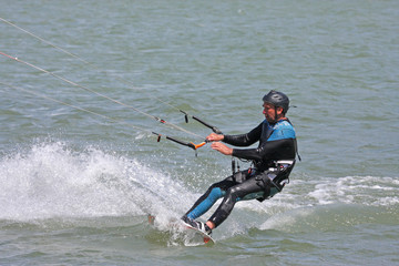 kitesurfer riding board