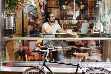 New ideas. Smart creative man thinking while searching for new ideas