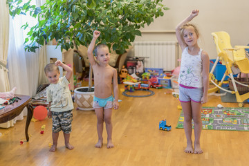 Children make exercises. The concept of a healthy lifestyle. Children's sports.