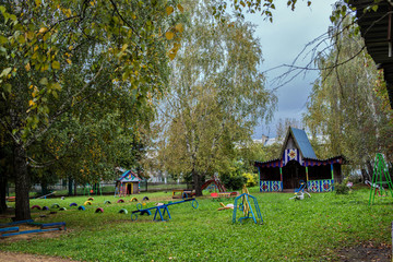 Obraz na płótnie Canvas Playground with swings In the kindergarten
