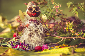 creature made of autumn chestnut and other fall components