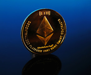 Etherum money crypto currency coin on reflective colorful background